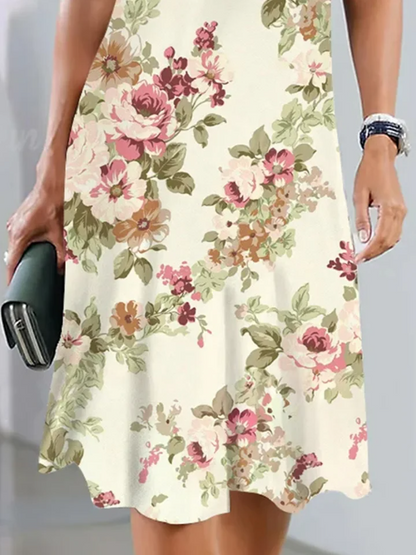 Veronica - Élégante robe midi à fleurs lâches pour garden party avec encolure ras du cou